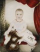 Baby With Rattle And Dog