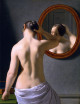 Woman Standing In Front Of A Mirror